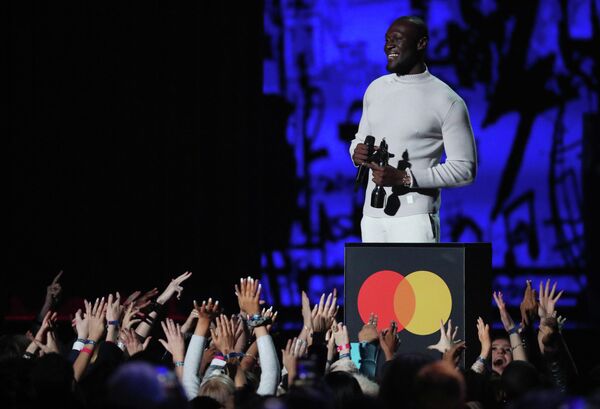 Рэпер Stormzy на церемонии вручения премии Brit Awards в Лондоне Рэпер Stormzy на церемонии вручения премии Brit Awards в Лондоне