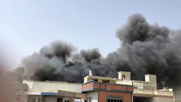 Место крушения самолета в Карачи. Кадр из видео очевидца Место крушения самолета в Карачи. Кадр из видео очевидца