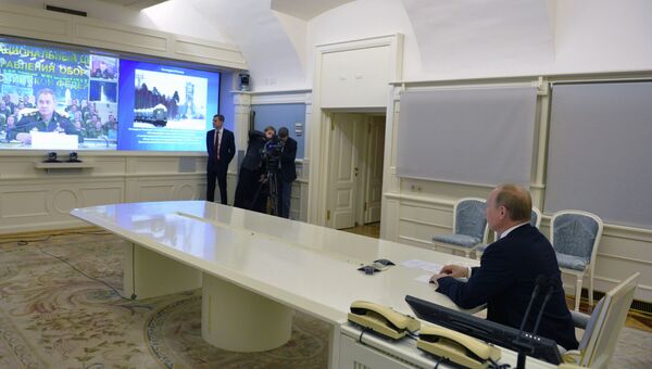 В.Путин провел видеоконференцию с космодромом Плесецк В.Путин провел видеоконференцию с космодромом Плесецк