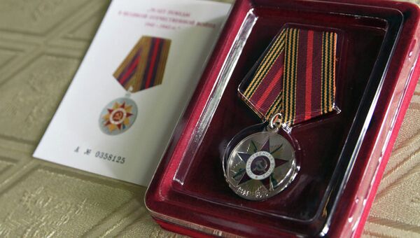 Медаль 70 лет Победы в Великой Отечественной войне 1941-1945 гг.. Архивное фото Медаль 70 лет Победы в Великой Отечественной войне 1941-1945 гг.. Архивное фото
