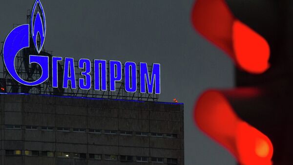 Логотип компании Газпром на административном здании в Москве. Архивное фото Логотип компании Газпром на административном здании в Москве. Архивное фото