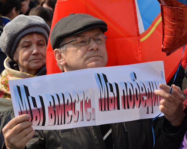 Участник митинга в честь третьей годовщины воссоединения Крыма с Россией во Владивостоке Участник митинга в честь третьей годовщины воссоединения Крыма с Россией во Владивостоке