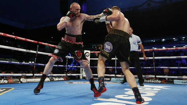 Российский боксер Федор Чудинов (справа) в бою за титул чемпиона WBA (Super) против Джорджа Гроувза. 27 мая 2017 Российский боксер Федор Чудинов (справа) в бою за титул чемпиона WBA (Super) против Джорджа Гроувза. 27 мая 2017