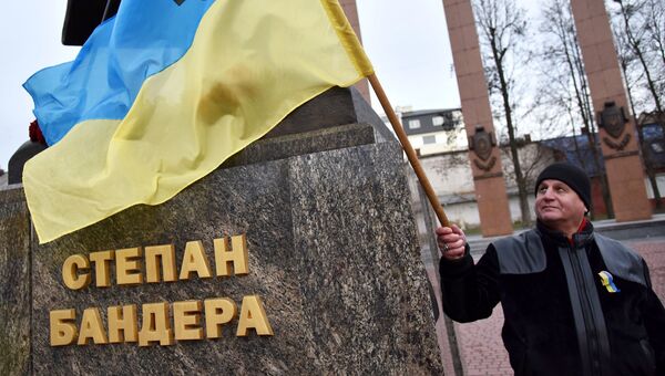 Участник марша националистов, приуроченного к 109-й годовщине со дня рождения Степана Бандеры, во Львове Участник марша националистов, приуроченного к 109-й годовщине со дня рождения Степана Бандеры, во Львове