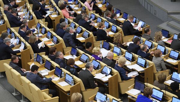 Депутаты на пленарном заседании Государственной Думы РФ. Архивное фото Депутаты на пленарном заседании Государственной Думы РФ. Архивное фото