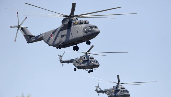 Тяжелый транспортный вертолёт Ми-26 и многоцелевые вертолёты Ми-8. Архивное фото Тяжелый транспортный вертолёт Ми-26 и многоцелевые вертолёты Ми-8. Архивное фото