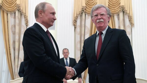 Владимир Путин и Джон Болтон. Архивное фото Владимир Путин и Джон Болтон. Архивное фото
