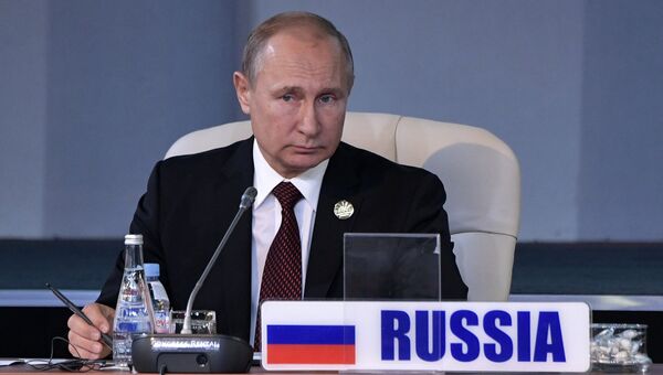 Президент РФ Владимир Путин во время встречи лидеров БРИКС на саммите в Йоханнесбурге. 27 июля 2018 Президент РФ Владимир Путин во время встречи лидеров БРИКС на саммите в Йоханнесбурге. 27 июля 2018