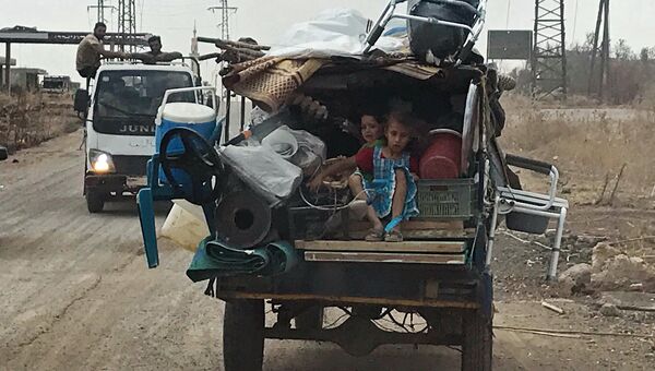 Дети в автомобиле на юго-западе сирийской провинции Дераа Дети в автомобиле на юго-западе сирийской провинции Дераа