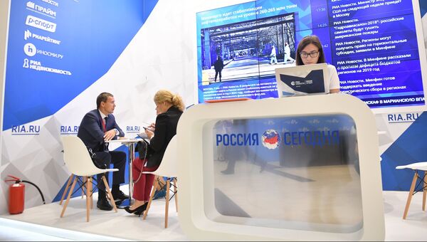 Генеральный директор АО Корпорация развития Дальнего Востока Денис Тихонов во время интервью у стенда Международного информационного агентства (МИА) Россия сегодня Генеральный директор АО Корпорация развития Дальнего Востока Денис Тихонов во время интервью у стенда Международного информационного агентства (МИА) Россия сегодня
