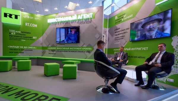 Стенд телеканала RT на площадке IV Восточного экономического форума во Владивостоке Стенд телеканала RT на площадке IV Восточного экономического форума во Владивостоке