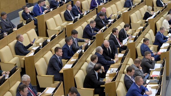 Депутаты на пленарном заседании Государственной Думы РФ. Архивное фото Депутаты на пленарном заседании Государственной Думы РФ. Архивное фото