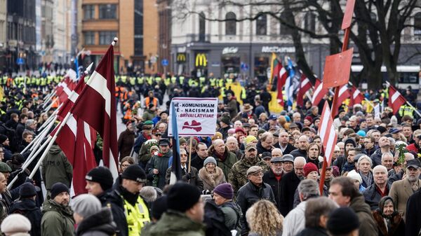 Участники марша легионеров Waffen SS в Риге. 16 марта 2019 Участники марша легионеров Waffen SS в Риге. 16 марта 2019