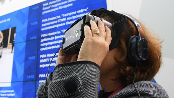 Генеральный директор ГТГ Зельфира Трегулова тестирует очки виртуальной реальности Gear VR на стенде МИА Россия Сегодня на Российском инвестиционном форуме в Сочи Генеральный директор ГТГ Зельфира Трегулова тестирует очки виртуальной реальности Gear VR на стенде МИА Россия Сегодня на Российском инвестиционном форуме в Сочи