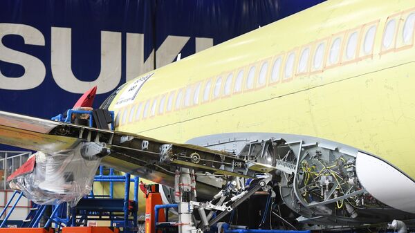 Самолет Sukhoi Superjet 100 в цехе окончательной сборки на заводе имени Гагарина в Комсомольске-на-Амуре Самолет Sukhoi Superjet 100 в цехе окончательной сборки на заводе имени Гагарина в Комсомольске-на-Амуре