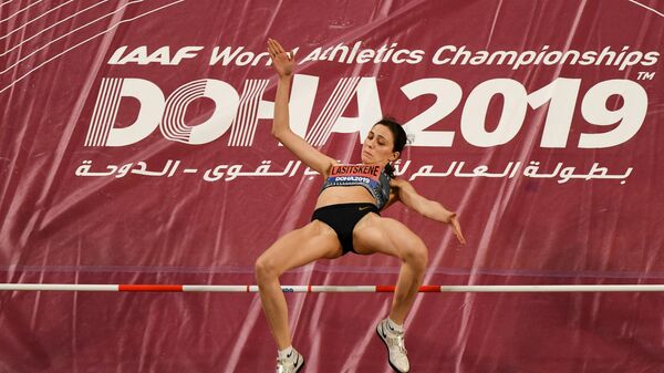 Мария Ласицкене (Россия) на чемпионате мира по легкой атлетике в Дохе
