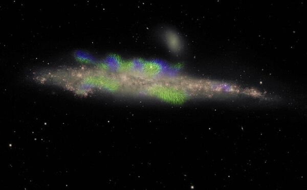 Составное изображение спиральной галактики NGC 4631. Розовым цветом показан звездный диск; зеленым – магнитные поля, направленные на нас; синим – от нас Составное изображение спиральной галактики NGC 4631. Розовым цветом показан звездный диск; зеленым – магнитные поля, направленные на нас; синим – от нас