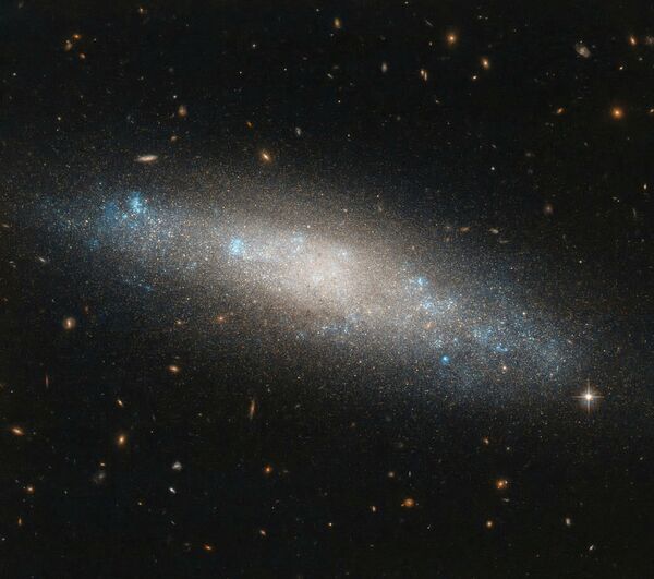 Спиральная галактика NGC 4455, расположенная в северном созвездии Волосы Вероники Спиральная галактика NGC 4455, расположенная в северном созвездии Волосы Вероники